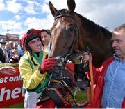 29 July 2015; Jockey Jonathan Burke pats Shanahan's Turn in the parade ring after winning the thetote.com Galway Plate. Galway Racing Festival, Ballybrit, Galway. Picture credit: Cody Glenn / SPORTSFILE