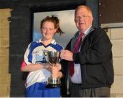 29 July 2015; Waterford captain Chloe Fennell is presented with the cup by Peter Rice, of the LGFA Management Committee, following her team's victory over Roscommon. All Ireland U16 B Ladies Football Championship Final, Roscommon v Waterford, McDonagh Park, Nenagh, Co. Tipperary. Picture credit: Seb Daly / SPORTSFILE