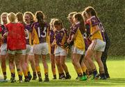 29 July 2015; Wexford players try to stay warm in the rain during the half-time break. All Ireland U16 C Ladies Football Championship Final, Leitrim v Wexford, Clane, Co. Kildare. Picture credit: Piaras Ó Mídheach / SPORTSFILE