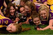 29 July 2015; Wexford captain Emma Cousins, centre, and her team-mates celebrate with the cup after the game. All Ireland U16 C Ladies Football Championship Final, Leitrim v Wexford, Clane, Co. Kildare. Picture credit: Piaras Ó Mídheach / SPORTSFILE