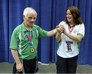 30 July 2015; Team Ireland’s Peter Malynn, a member of St Hilda’s Work Therapy Unit, from Mullingar, Co. Westmeath, with Special Olympics Ireland Bocce head coach Jackie Moran after he was presented with his Gold Medal at the Los Angeles Convention Center. Special Olympics World Summer Games, Los Angeles, California, United States. Picture credit: Ray McManus / SPORTSFILE