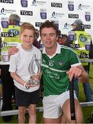 30 July 2015; Shane Cross, aged 10, from St. Patrick's GAA club, Limerick, presents the Bord Gáis Energy Man of the Match award to Ronan Lynch, Limerick. Bord Gáis Energy Munster GAA Hurling U21 Championship Final, Clare v Limerick, Cusack Park, Ennis, Co. Clare. Picture credit: Diarmuid Greene / SPORTSFILE