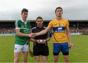 30 July 2015; Limerick captain Diarmaid Byrnes and Clare captain Conor Cleary exchange a handshake in the company of referee Fergal Horgan before the game. ord Gáis Energy Munster GAA Hurling U21 Championship Final, Clare v Limerick, Cusack Park, Ennis, Co. Clare. Picture credit: Diarmuid Greene / SPORTSFILE