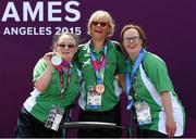 31 July 2015; Nuala Browne, left, a member of North West Special Olympics Club, from Strabane, Co Tyrone, celebrates with Team Ireland team mates Rita Quirke, who won a Bronze Medal and Nicola Higgins, who was presented with a 5th place ribbon, after she was  presented with a Silver Medal after finishing second in the KT 500M Race Singles Tourist - Div 06, in the Kayaking at the Miami Marine Stadium, Long Beach. Special Olympics World Summer Games, Los Angeles, California, United States. Picture credit: Ray McManus / SPORTSFILE