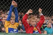 30 July 2015; Brothers Aidan Moloney, aged 7, left, and Niall Moloney, aged 9, from Sixmilebridge, Co. Clare, during the game. Bord Gáis Energy Munster GAA Hurling U21 Championship Final, Clare v Limerick, Cusack Park, Ennis, Co. Clare. Picture credit: Diarmuid Greene / SPORTSFILE