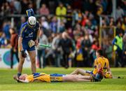 30 July 2015; Clare players David Fitzgerald, goalkeeper Keith Hogan and Shane O'Brien, react after defeat to Limerick. Bord Gáis Energy Munster GAA Hurling U21 Championship Final, Clare v Limerick, Cusack Park, Ennis, Co. Clare. Picture credit: Diarmuid Greene / SPORTSFILE