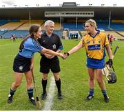 1 August 2015; Referee Cathal Egan looks on as Dublin captain Rachel Noctor and Clare captain Kate Lynch shake hands before the start of the game. Liberty Insurance Senior Camogie Championship Play-Off, Clare v Dublin. Semple Stadium, Thurles, Co. Tipperary. Picture credit: Matt Browne / SPORTSFILE