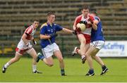 1 August 2015; Michael McEvoy, Derry, in action against Ruairi Harkins, left, and Kevin Sorohan, Derry. Electric Ireland GAA Football All-Ireland Minor Championship Quarter-Final, Longford v Derry. Brewster Park, Enniskillen, Co. Fermanagh. Picture credit: Oliver McVeigh / SPORTSFILE