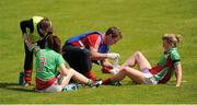 1 August 2015; Mayo's Sarah Tierney, left, and Fiona McHale, are tended to by the physiotherapists during the game. TG4 Ladies Football All-Ireland Senior Championship Qualifier Round 2, Mayo v Tyrone. Ballinamore, Co. Leitrim. Picture credit: Seb Daly / SPORTSFILE