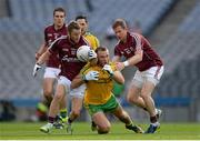 1 August 2015; Michael Lundy, Galway, supported by team-mate Gary Sice, right, dispossesses Neil McGee, Donegal. GAA Football All-Ireland Senior Championship, Round 4B, Donegal v Galway. Croke Park, Dublin. Picture credit: Brendan Moran / SPORTSFILE