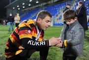21 November 2008; Charl Oosthuizen, Lansdowne, shows his winners medal to his son Zander, age 2 and a half, after the match. Leinster Senior League Cup Final, Clontarf v Lansdowne, Donnybrook Stadium, Dublin. Picture credit: Stephen McCarthy / SPORTSFILE