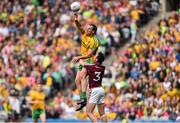 1 August 2015; Michael Murphy, Donegal, under pressure from Finian Hanley, Galway, passes to team-mate Ryan McHugh to set up his side's second goal. GAA Football All-Ireland Senior Championship, Round 4B, Donegal v Galway. Croke Park, Dublin. Picture credit: Ramsey Cardy / SPORTSFILE