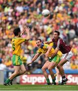 1 August 2015; Michael Murphy, Donegal, under pressure from Finian Hanley, Galway, passes to team-mate Ryan McHugh to set up his side's second goal. GAA Football All-Ireland Senior Championship, Round 4B, Donegal v Galway. Croke Park, Dublin. Picture credit: Ramsey Cardy / SPORTSFILE