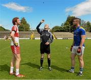 1 August 2015; Referee Liam Devenney performs the coin toss in the company of team captains Conor Glass, Derry, left, and Conor Berry, Longford. Electric Ireland GAA Football All-Ireland Minor Championship Quarter-Final, Longford v Derry. Brewster Park, Enniskillen, Co. Fermanagh. Picture credit: Oliver McVeigh / SPORTSFILE