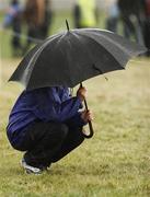 23 November 2008; A spectator takes cover during the Woodie's DIY / AAI Inter county & juvenile even ages championships. Tramore Racecourse, Waterford. Picture credit: Tomas Greally / SPORTSFILE