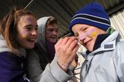 23 November 2008; Kilmacud Crokes fan Brian Sheehy, age 7, has his face painted by Siofra Walsh and Jenny Freeley. AIB Leinster Senior Club Football Championship Semi-Final, Kilmacud Crokes v Navan O'Mahony's, Parnell Park, Dublin. Picture credit: Ray Lohan / SPORTSFILE *** Local Caption ***