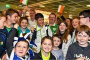 3 August 2015; Ireland's Kevin McGrath, age 16, Bohermeen A.C., Navan, Co. Meath, is welcomed home by family and friends after winning a gold medal in the 1500-meters, at the Irish team's return from the European Youth Olympics. Dublin Airport, Dublin. Picture credit: Cody Glenn / SPORTSFILE