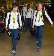 3 August 2015; Ireland gold medallists Kevin McGrath, age 16, Bohermeen A.C., Navan, 1500-meters, and Ciara Neville, age 15, Emerald A.C., Limerick, 100-meters, lead team-mates into the terminal at the Irish team's return from the European Youth Olympics. Dublin Airport, Dublin. Picture credit: Cody Glenn / SPORTSFILE