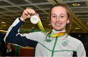 3 August 2015; Ireland's Ciara Neville, age 15, Emerald A.C., Limerick, holds up her gold medal for the 100-meter, at the Irish team's return from the European Youth Olympics. Dublin Airport, Dublin. Picture credit: Cody Glenn / SPORTSFILE