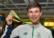 3 August 2015; Ireland's Kevin McGrath, age 16, Bohermeen A.C., Navan, Co. Meath, holds up his gold medal he won in the 1500-meters, at the Irish team's return from the European Youth Olympics. Dublin Airport, Dublin. Picture credit: Cody Glenn / SPORTSFILE