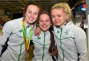3 August 2015; Ireland team-mates, from left, Ciara Neville, age 15, Emerald A.C., Limerick, gold medallist in the 100-meters, cyclist Shauna McFadden, age 15, Letterkenny, Donegal, and Molly Scott, age 16, St. Laurence O'Toole A.C., Carlow, 100-meter hurdles, at the Irish team's return from the European Youth Olympics. Dublin Airport, Dublin. Picture credit: Cody Glenn / SPORTSFILE