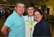 3 August 2015; Ireland gold medallist Kevin McGrath, age 16, Bohermeen A.C., Navan, Co. Meath, welcomed home by parents Eamon and Paula at the Irish team's return from the European Youth Olympics. Dublin Airport, Dublin. Picture credit: Cody Glenn / SPORTSFILE