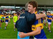 3 August 2015; Tipperary's Jamie Bergin celebrates with manager Charlie McGeever after the game. Electric Ireland GAA Football All-Ireland Minor Championship, Quarter-Final, Galway v Tipperary. O'Connor Park, Tullamore, Co. Offaly. Picture credit: Piaras Ó Mídheach / SPORTSFILE
