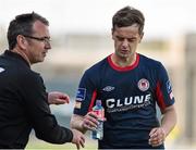 3 August 2015; Pat Fenlon, Shamrock Rovers manager, passes a bottle of water to Greg Bolger, St Patrick's Athletic. EA Sports Cup Semi-Final, Shamrock Rovers v St Patrick's Athletic. Tallaght Stadium, Tallaght Co. Dublin. Picture credit: David Maher / SPORTSFILE