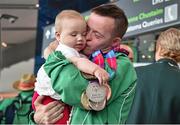 4 August 2015; Team Ireland's Paul Keane, from Ferns, Co. Wexford, reunites with his neice Mila, age 6 months, with his five medals: a gold, three silvers and a bronze, as well as two ribbons for gymnastics during their homecoming. Team Ireland returns from the Special Olympics World Summer Games. Terminal 2, Dublin Airport. Picture credit: Cody Glenn / SPORTSFILE