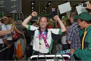 4 August 2015; Team Ireland's Francis Power, from Navan, Co. Meath, proudly walks through the crowd with his gold medal for table tennis during their homecoming. Team Ireland returns from the Special Olympics World Summer Games. Terminal 2, Dublin Airport. Picture credit: Cody Glenn / SPORTSFILE