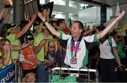 4 August 2015; Team Ireland's Francis Power, from Navan, Co. Meath, salutes the crowd wearing his gold medal for table tennis during their homecoming. Team Ireland returns from the Special Olympics World Summer Games. Terminal 2, Dublin Airport. Picture credit: Cody Glenn / SPORTSFILE