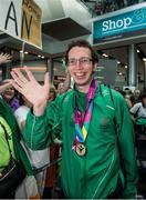 4 August 2015; Team Ireland’s Brendan O’Connell, left, a member of Kerry Stars Special Olympics Club, from Tralee, Co. Kerry, at Dublin Airport during their homecoming. Team Ireland returns from the Special Olympics World Summer Games. Terminal 2, Dublin Airport. Picture credit: Ray McManus / SPORTSFILE