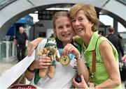 4 August 2015; Team Ireland's Amy Duffy, from Skerries, Co. Dublin, a gold medalist in basketball, is hugged by her mother Margaret Duffy at Dublin Airport during their homecoming. Team Ireland returns from the Special Olympics World Summer Games. Terminal 2, Dublin Airport. Picture credit: Cody Glenn / SPORTSFILE