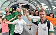 4 August 2015; Team Ireland's Thomas Caulfield, from Ballyfermot, Co. Dublin, who triumphantly returned with a bronze in football, is greeted by family at Dublin Airport during the team homecoming. Team Ireland returns from the Special Olympics World Summer Games. Terminal 2, Dublin Airport. Picture credit: Cody Glenn / SPORTSFILE