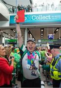 4 August 2015; Team Ireland’s Timothy Morahan, a member of South Dublin Special Olympics Sports Club, from Rathmines, Dublin, at Dublin Airport during their homecoming. Team Ireland returns from the Special Olympics World Summer Games. Terminal 2, Dublin Airport. Picture credit: Ray McManus / SPORTSFILE