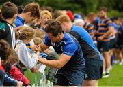 4 August 2015; Leinster's Colm O'Shea signs autographs for supporters following squad training. Leinster Rugby Squad Training. Edenderry, Co. Offaly. Picture credit: Seb Daly / SPORTSFILE