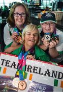 4 August 2015; Team Ireland’s Nicola Higgins, left, a member of Free Spirit Special Olympics Kayaking Club, from Coolock, Dublin, Rita Quirke, a member of Moore Abbey Special Olympics Club, from Rathangan, Co Meath, and Nuala Browne, a member of North West Special Olympics Club, from Strabane, Co Tyrone, during the homecoming. Team Ireland returns from the Special Olympics World Summer Games. Terminal 2, Dublin Airport. Picture credit: Ray McManus / SPORTSFILE