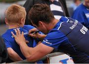 4 August 2015; Leinster's Colm O'Shea signs an autograph for a supporter after squad training. Leinster Rugby Squad Training. Edenderry, Co. Offaly. Picture credit: Seb Daly / SPORTSFILE