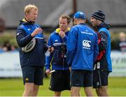 4 August 2015; Leinster forwards coach Leo Cullen speaks with Daniel Tobin, Head of Fitness, Bryan Cullen, Lead Academy Strength & Conditioning Coach and Girvan Dempsey, Academy Manager, during squad training. Leinster Rugby Squad Training. Edenderry, Co. Offaly. Picture credit: Seb Daly / SPORTSFILE