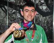 4 August 2015; Team Ireland's James Meenan, a member of St Therese’s Special Olympics Club, from Dundalk, Co Louth, displays the medals he won in track and field at Dublin Airport during their homecoming. Team Ireland returns from the Special Olympics World Summer Games. Terminal 1, Dublin Airport. Picture credit: Cody Glenn / SPORTSFILE