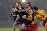 29 November 2008; Chris Whitaker, Leinster, is tackled by Phillip Dollman and Adam Black, Newport Gwent Dragons. Magners League, Leinster v Newport Gwent Dragons, RDS, Dublin. Picture credit: Maurice Doyle / SPORTSFILE
