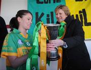 29 November 2008; Kilmihil captain Fiona O'Neill is presented with the cup by Geraldine Giles, President of Cumann Peil na mBan. VHI Healthcare All-Ireland Ladies Junior Club Football Championship Final, Kilmihil, Clare, v Knockmore, Mayo. Tuam Stadium, Tuam, Co. Galway. Picture credit: Ray Ryan / SPORTSFILE