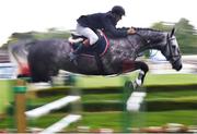 5 August 2015; Rider Michael Murphy, Ireland, clears the last jump on Ahg Whiterock Cruise Down on their way to winning the 6-year-Old Horses event sponsored by Horse Sport Ireland during the Discover Ireland Dublin Horse Show 2015. RDS, Ballsbridge, Dublin. Picture credit: Cody Glenn / SPORTSFILE