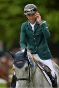 6 August 2015; Bertram Allen, Ireland, takes a lap around the arena on Quiet Easy 4 after their second-place finish in the Serpentine Speed Stakes sponsored by CityJet during the Discover Ireland Dublin Horse Show 2015. RDS, Ballsbridge, Dublin. Picture credit: Cody Glenn / SPORTSFILE