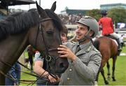 6 August 2015; Emanuele Guadiano, Italy, with Cocoshynsky after their first-place ride in the Serpentine Speed Stakes sponsored by CityJet during the Discover Ireland Dublin Horse Show 2015. RDS, Ballsbridge, Dublin. Picture credit: Cody Glenn / SPORTSFILE