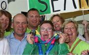 4 August 2015; Gerard, 2nd left, and Fidelma Coleman, right,  join their son Team Ireland’s Sean Coleman, a member of Cork Special Olympics Swimming Club, from Youghal, Co. Cork, and friends at the homecoming. Team Ireland returns from the Special Olympics World Summer Games. Terminal 1, Dublin Airport. Picture credit: Ray McManus / SPORTSFILE