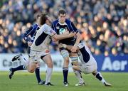 6 December 2008; Devin Toner, Leinster, is tackled by Florian Faure, left, and Anthony Lagardere, Castres Olympique. Heineken Cup, Pool 2, Round 3, Leinster v Castres Olympique, RDS, Dublin. Picture credit: Brendan Moran / SPORTSFILE