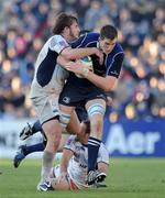 6 December 2008; Devin Toner, Leinster, is tackled by Florian Faure, left, and Anthony Lagardere, Castres Olympique. Heineken Cup, Pool 2, Round 3, Leinster v Castres Olympique, RDS, Dublin. Picture credit: Brendan Moran / SPORTSFILE