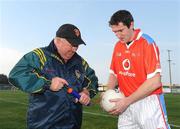 7 December 2008; Malachy Higgins, from Gortlettragh, Co Leitrim, assists Cork's Graham Canty before the start of the Vodafone GAA All-Star game. GAA Football All-Stars Tour, Páirc na nGael, Treasure Island, San Francisco, USA. Picture credit: Ray McManus / SPORTSFILE