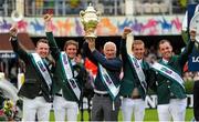 7 August 2015; The Winning Ireland team, from left to right, Greg Patrick Broderick, Darragh Kenny, Chef d'Equipe Robert Splaine, Bertram Allen and Cian O'Connor celebrate their victory in the Furusiyya FEI Nations Cup during the Discover Ireland Dublin Horse Show 2015. RDS, Ballsbridge, Dublin. Picture credit: Seb Daly / SPORTSFILE